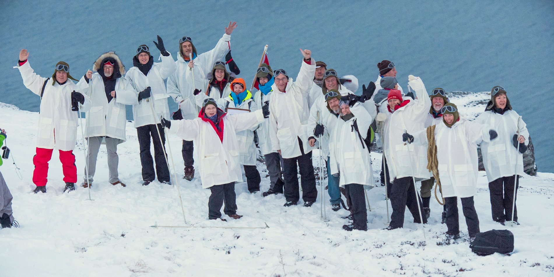 A group of people posing for a picture in the snow