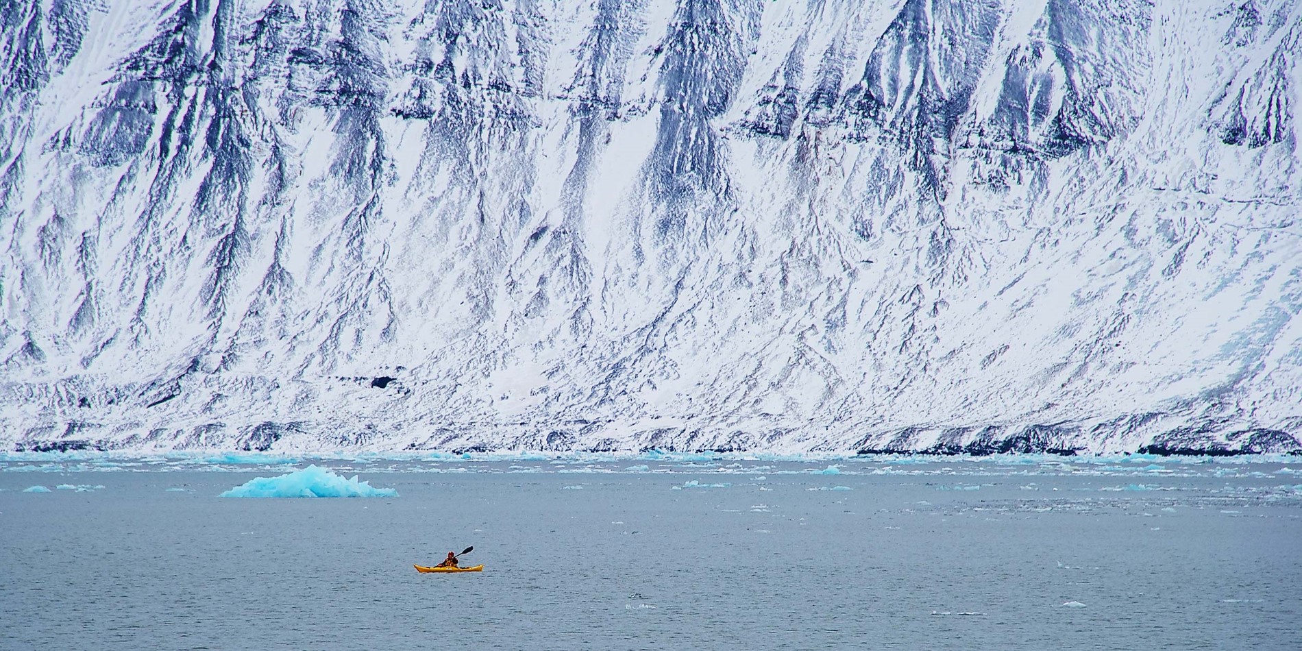 Explore the Arctic waters from a kayak